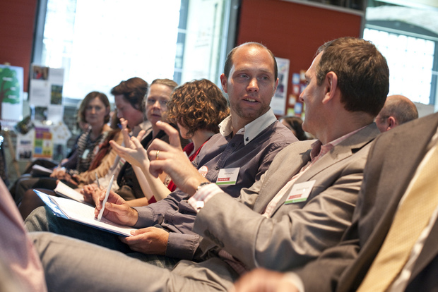 Participants discuss happiness at a Action for Happiness event. Participants discuss happiness at a Action for Happiness event.