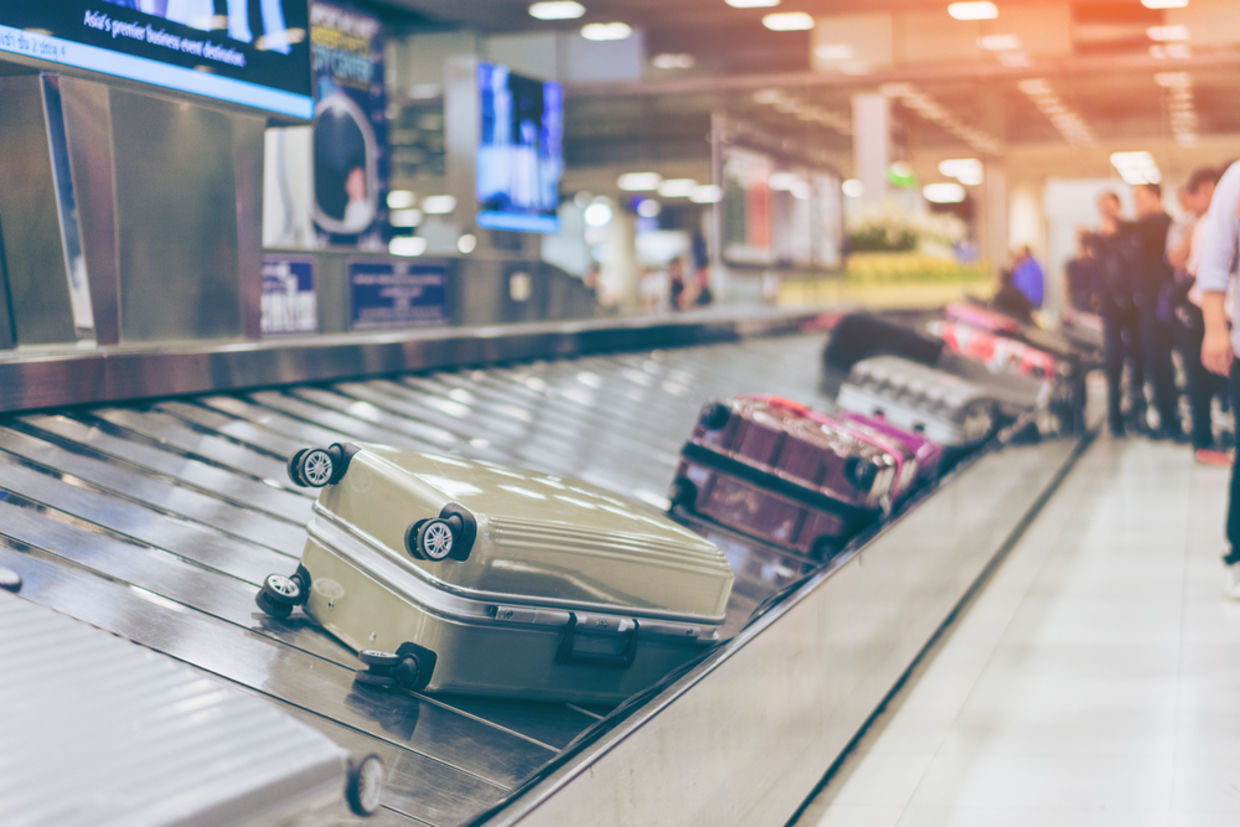 Suitcase or luggage with conveyor belt in the international airport Suitcase or luggage with conveyor belt in the international airport