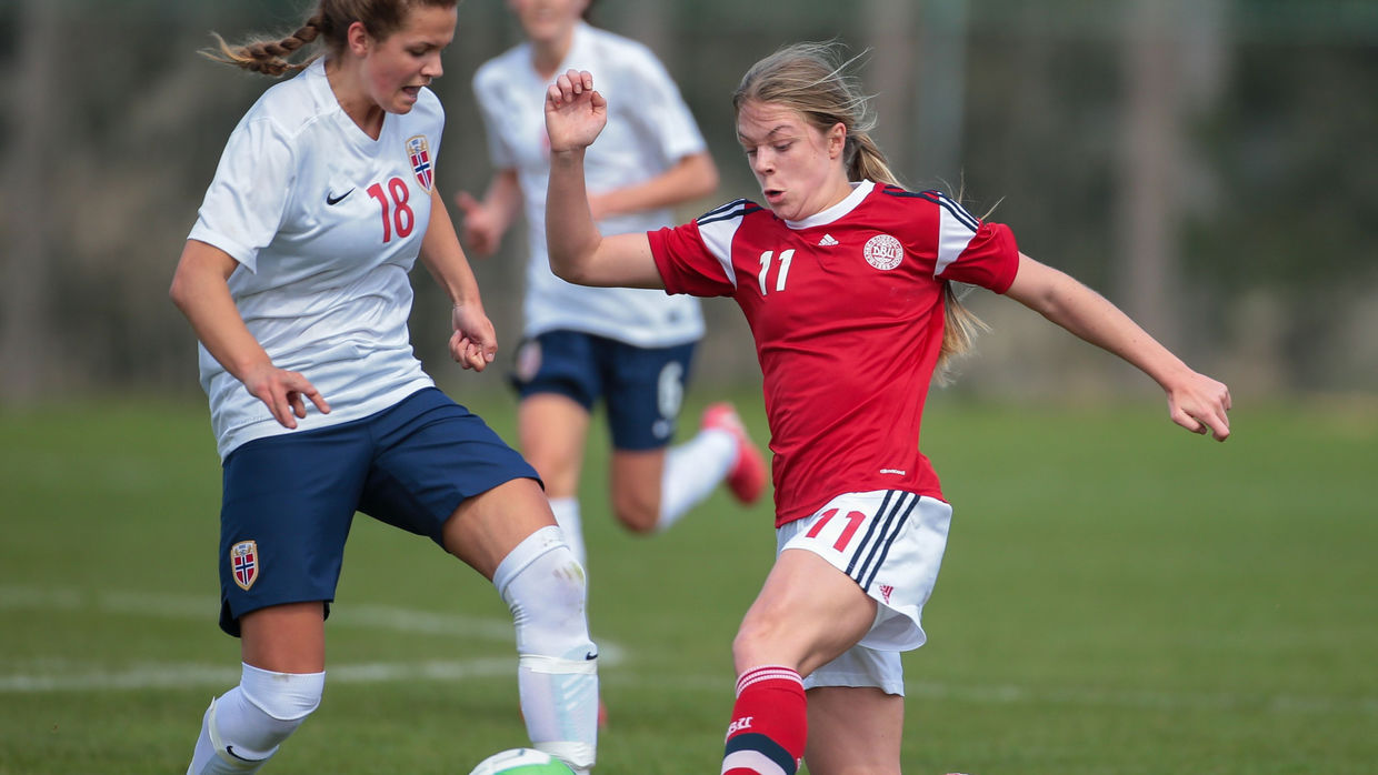 Andrea Norheim (#18 Norway) and Freja Kjaersig Sunesen (#11 Denmark) fight for the ball during a UEFA women's U17 qualifying game Andrea Norheim (#18 Norway) and Freja Kjaersig Sunesen (#11 Denmark) fight for the ball during a UEFA women's U17 qualifying game