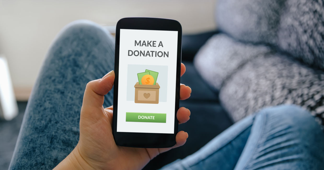 A smartphone with a donate button. A smartphone with a donate button.