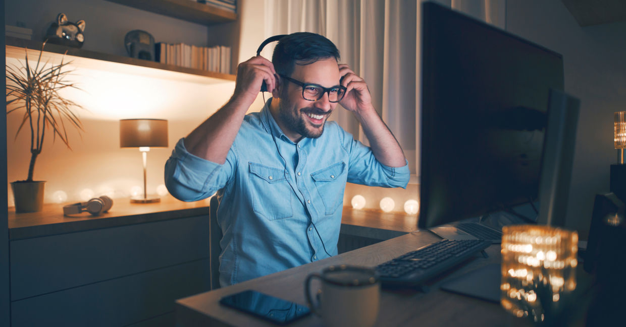 Man working in his home office after hours Man working in his home office after hours