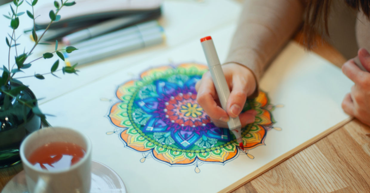 A woman draws a mandala. A woman draws a mandala.