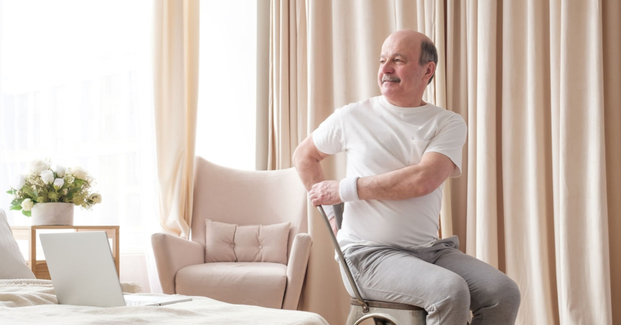 A man sits in a chair and twists, activating the vagus nerve in his torso. A man sits in a chair and twists, activating the vagus nerve in his torso.