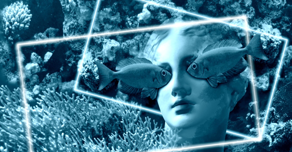 Face of ancient status on an underwater background with corals and fish Face of ancient status on an underwater background with corals and fish
