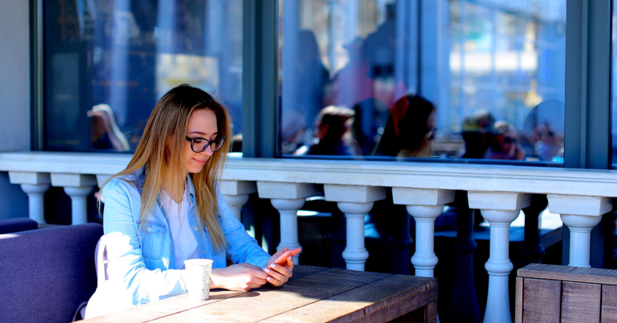 Young woman using her smartphone to boost productivity. Young woman using her smartphone to boost productivity.