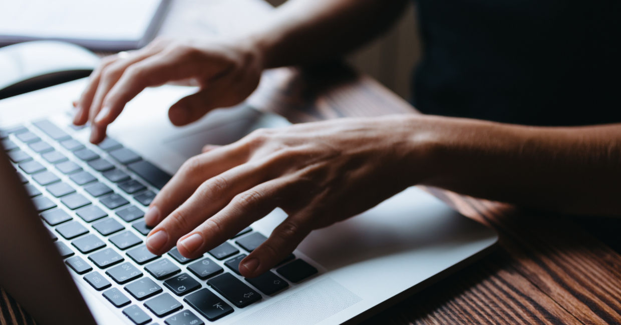 A woman typing.