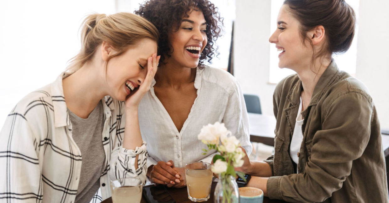 A group of friends talking and laughing. A group of friends talking and laughing.