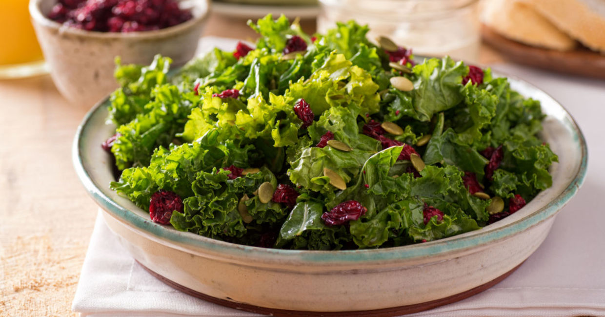 A kale, cranberry, and pumpkin seed salad is a healthy lunch choice. A kale, cranberry, and pumpkin seed salad is a healthy lunch choice.