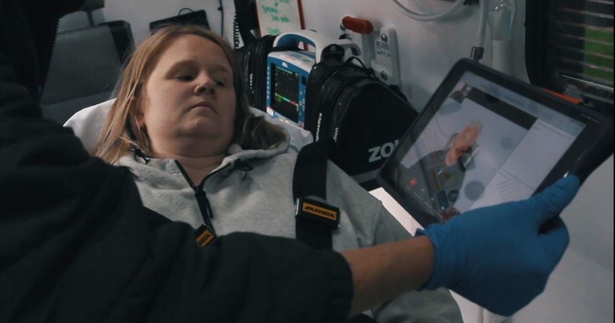 Using a sign language app in an ambulance. Using a sign language app in an ambulance.