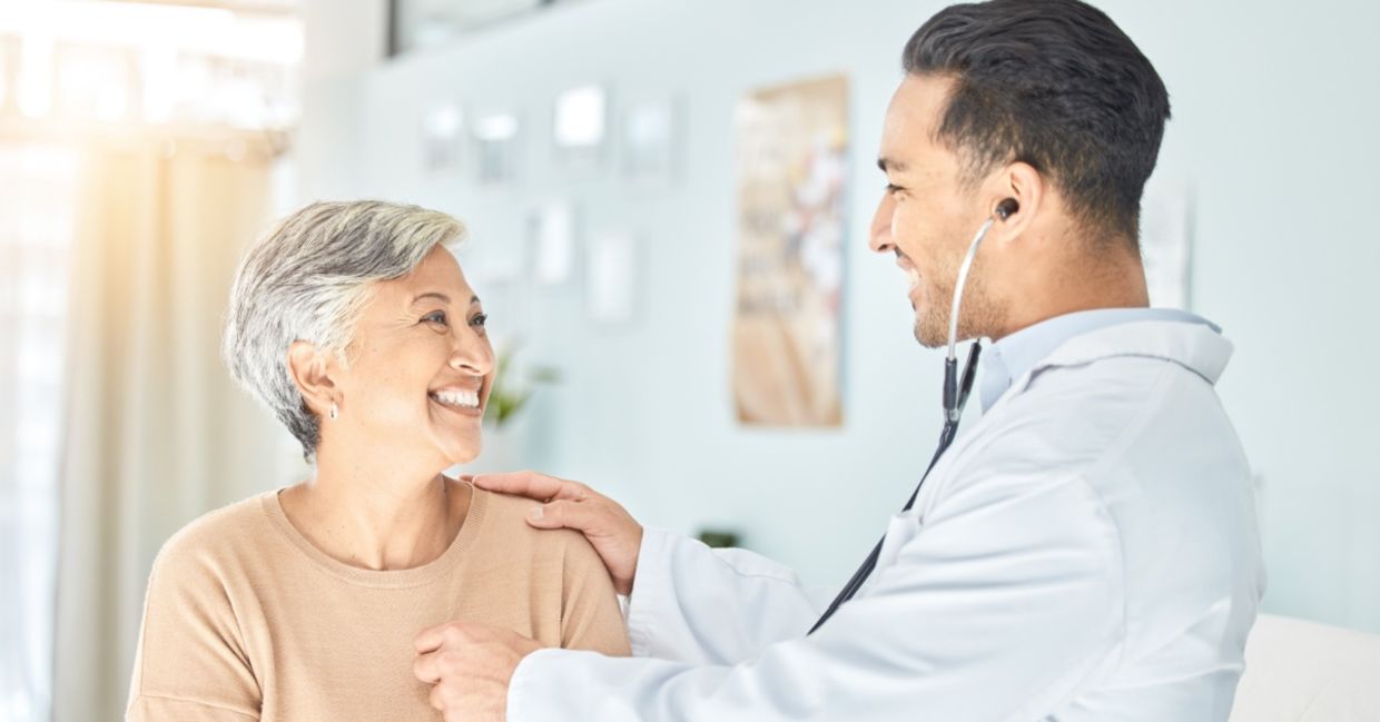 Cardiologist listening to a senior patient’s heart. Cardiologist listening to a senior patient’s heart.