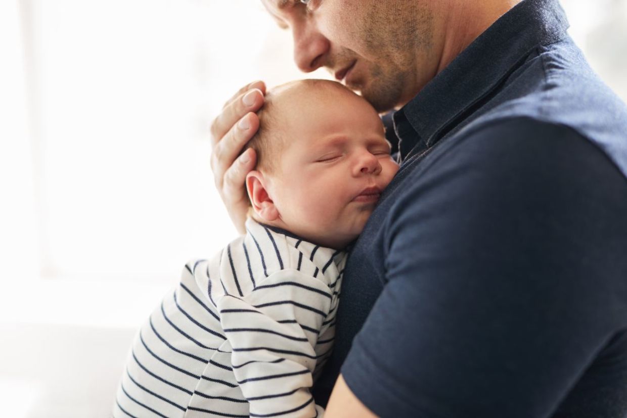 Father holding his newborn. Father holding his newborn.