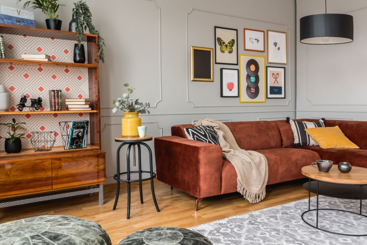 Eclectic living room with a rust-colored sofa. Eclectic living room with a rust-colored sofa.