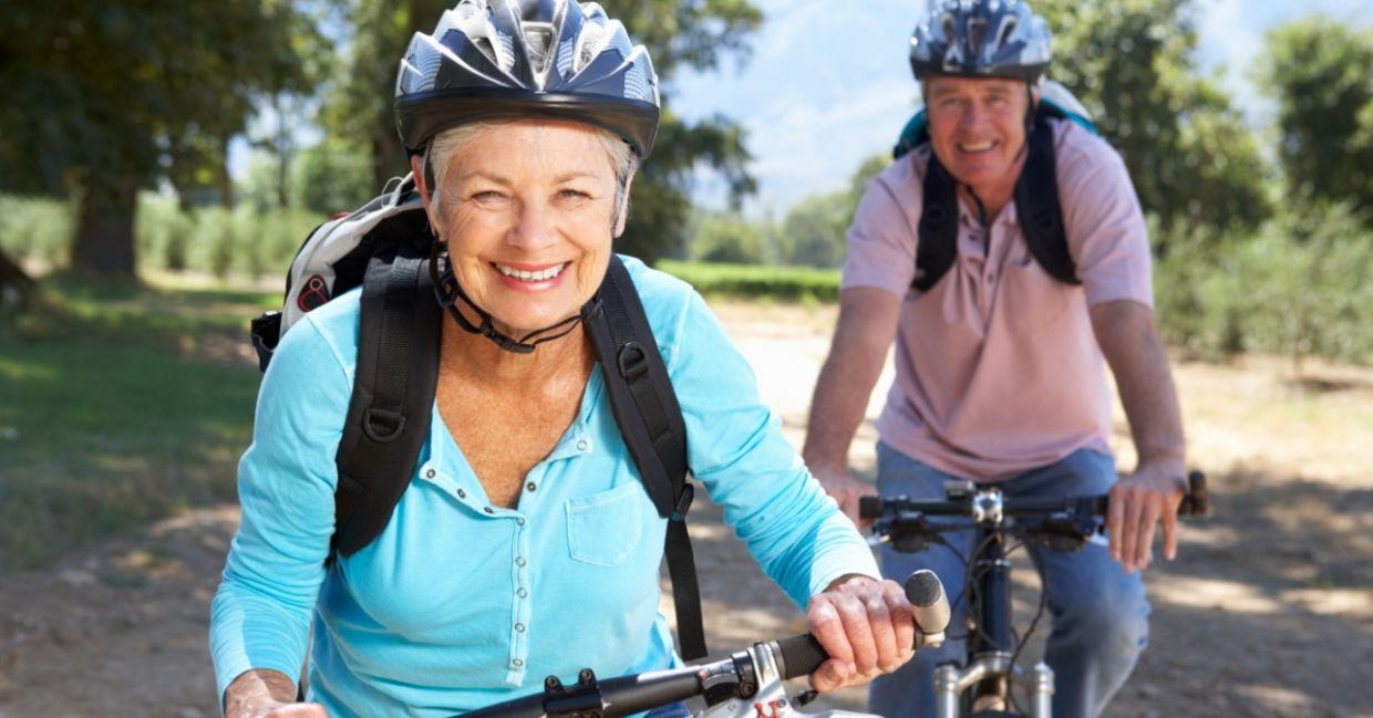 Two healthy seniors riding bikes. Two healthy seniors riding bikes.